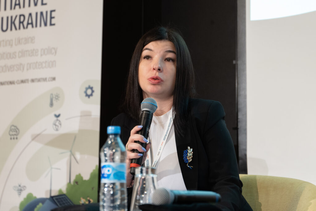 A women is talking into a microphone