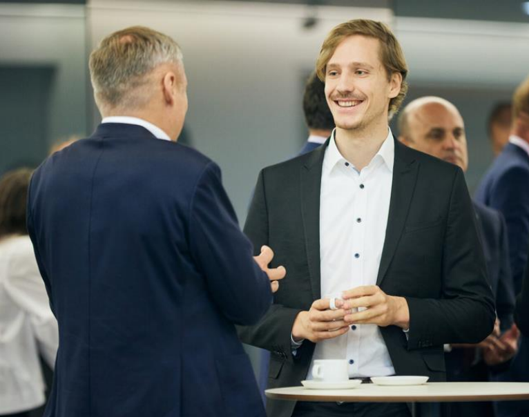 Rouven Stubbe is talking to another man